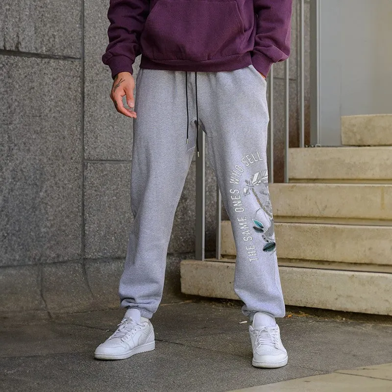 The Same Ones Who Sell The Panic Sell The Cure GRAPHIC PRINT JOGGERS